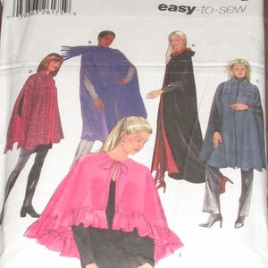 May include: Simplicity sewing pattern featuring cape designs. The pattern includes various cape styles in different colors, including red, blue, and black. The text "easy-to-sew" is visible on the packaging.