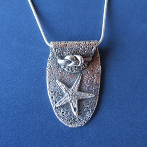 Colar de prata fina estrela do mar na praia---Item SN 501