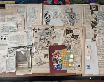 May include: A collection of vintage paper ephemera, including old magazine pages, newspaper clippings, and a lace doily. The papers are arranged on a wooden surface and feature a variety of images and text, including a diagram of the human body, a vintage advertisement for a product called "Dref", and a page of sheet music. There are also a few small, colorful stickers and a set of letter tiles spelling out "R.A.M."