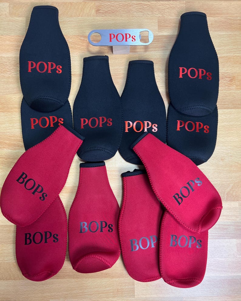 May include: A set of 10 bottle coolers, 5 black and 5 red, with the word "POPS" printed in red on the black coolers and "BOPS" printed in black on the red coolers. A silver bottle opener with the word "POPS" printed on it is also included.
