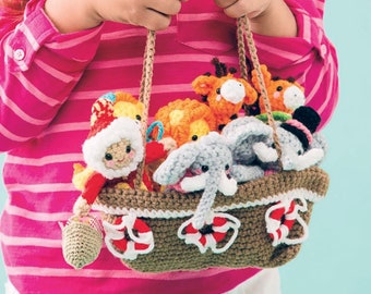 May include: A crocheted basket with a brown and white striped design, filled with various crocheted animal toys, including a giraffe, elephant, lion, and a small person wearing a red and white hat. The basket has two brown straps and is being held by a child.