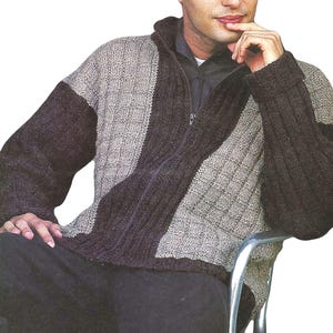 May include: A brown and beige knitted sweater with a zip closure. The sweater has a diagonal pattern and a high collar.
