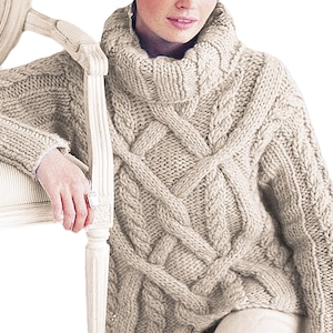 May include: A cream-colored cable knit sweater with a high turtleneck. The sweater has a loose fit and is made of a soft, chunky yarn.