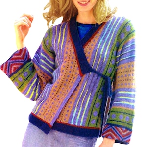 May include: A colorful knitted cardigan with a wrap style closure and a geometric pattern. The cardigan is made with a variety of colors, including purple, blue, green, and brown.