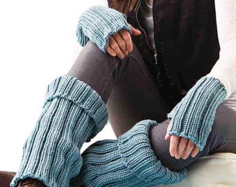 May include: A set of light blue knitted leg warmers and matching fingerless gloves. The ribbed knitwear is a soft, muted blue color. The leg warmers are folded over at the top. The gloves have a ribbed cuff and open fingers.