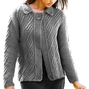 May include: A grey knitted cardigan with a textured pattern and a single button fastening. The cardigan features a collared neckline and long sleeves. The design incorporates textured stitches and diagonal patterns, creating a cosy and stylish appearance.