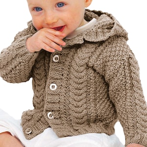 May include: A brown baby cardigan with a hood and cable knit detailing. The cardigan features three white buttons and a ribbed hem and cuffs. The hood has a decorative, ruffled edge.