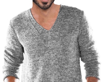 May include: A gray V-neck sweater with long sleeves. The sweater has a textured knit pattern and a relaxed fit. The neckline is a deep V-shape.