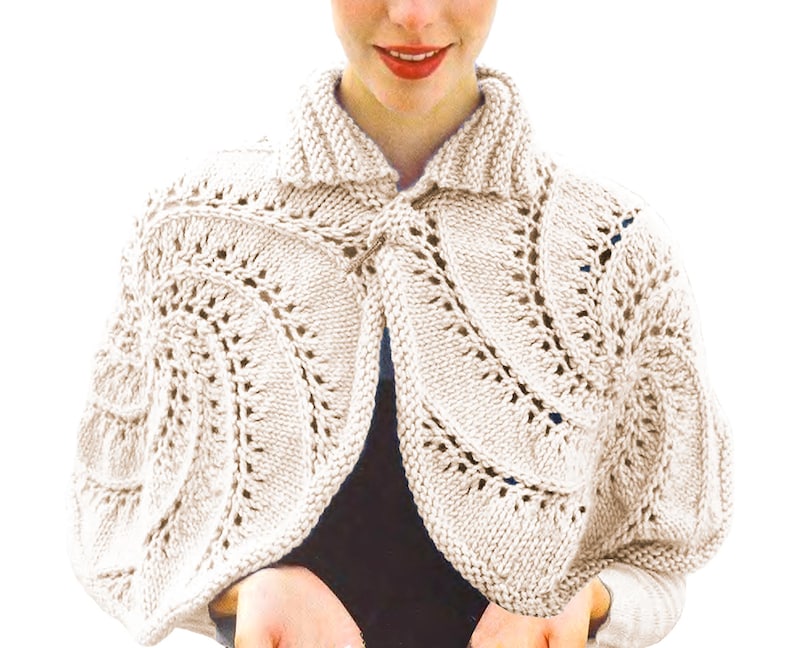 May include: A cream-coloured knitted bolero with a collar and detailed openwork pattern. The bolero has a button fastening at the front and is made from a soft, textured yarn. This elegant piece is ideal for layering and adds a touch of sophistication to any outfit.