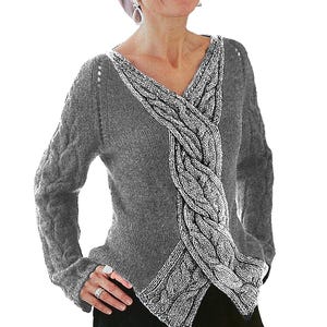 May include: A grey cable-knit jumper with a distinctive design. The jumper has a braided cable detail across the front. The sleeves feature a cable knit pattern. The jumper is a neutral colour, suitable for various outfits.