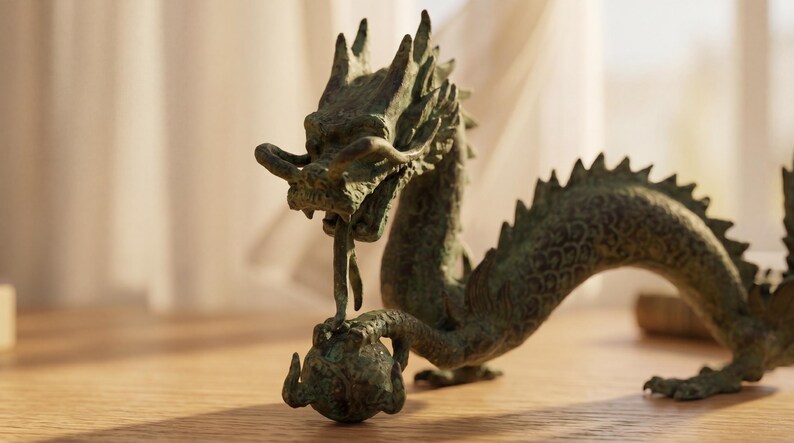 May include: A bronze dragon sculpture with intricate details. The dragon is depicted with a long body, spiky dorsal fins, and a detailed head. It is holding a sphere in its claws, a classic representation of power and wisdom.