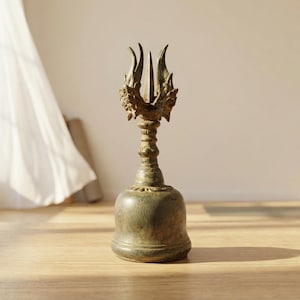 May include: A set of three ceramic mugs with a speckled, matte finish. The mugs are in shades of cream, light gray, and dark gray. Each mug has a simple, minimalist design, perfect for coffee or tea.