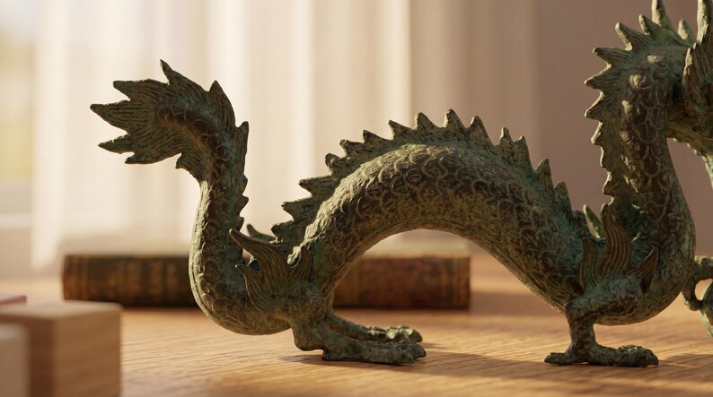 May include: A bronze-colored dragon figurine with intricate details, including scales and a spiky spine. The dragon is posed in a curved position, with its head and tail raised. The figurine is on a wooden surface.
