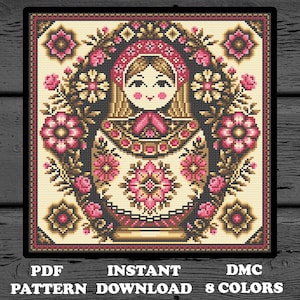 May include: Cross stitch pattern featuring a traditional Russian nesting doll, or Matryoshka doll, surrounded by floral designs. The pattern is in black, white, pink, and brown. The text "PDF PATTERN DOWNLOAD 8 COLORS" is at the bottom of the image.