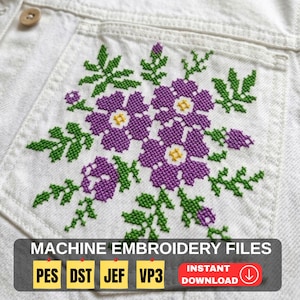May include: Close-up of a white denim jacket pocket with a cross-stitched floral design in purple, green, and yellow. The text "MACHINE EMBROIDERY FILES" is displayed with file type abbreviations and an instant download icon.
