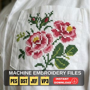 Pode incluir: Uma camisa branca com um bolso apresentando um bordado em ponto cruz com motivos florais em tons de rosa, amarelo e verde. A imagem inclui o texto MACHINE EMBROIDERY FILES, PES, DST, JEF, VP3 e INSTANT DOWNLOAD.