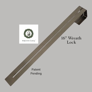 May include: A silver-colored 16-inch Wreath Lock with a rectangular design. The product has a slot and a hook for hanging. The Wreath Lock logo is visible, along with the text "Patent Pending."