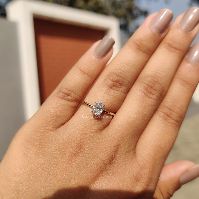Buy Engagement Ring featuring a handmade oval-cut diamond in a modern design.