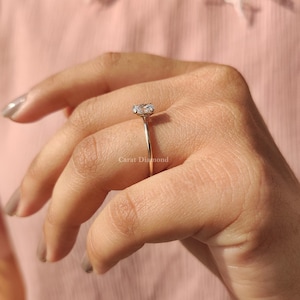 Minimalist Oval Solitaire Ring featuring a lab-grown diamond with IGI certification.