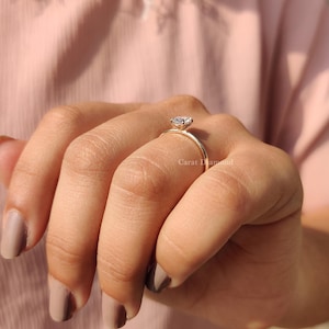 Buy Engagement Ring featuring a handmade oval-cut diamond in a modern design.