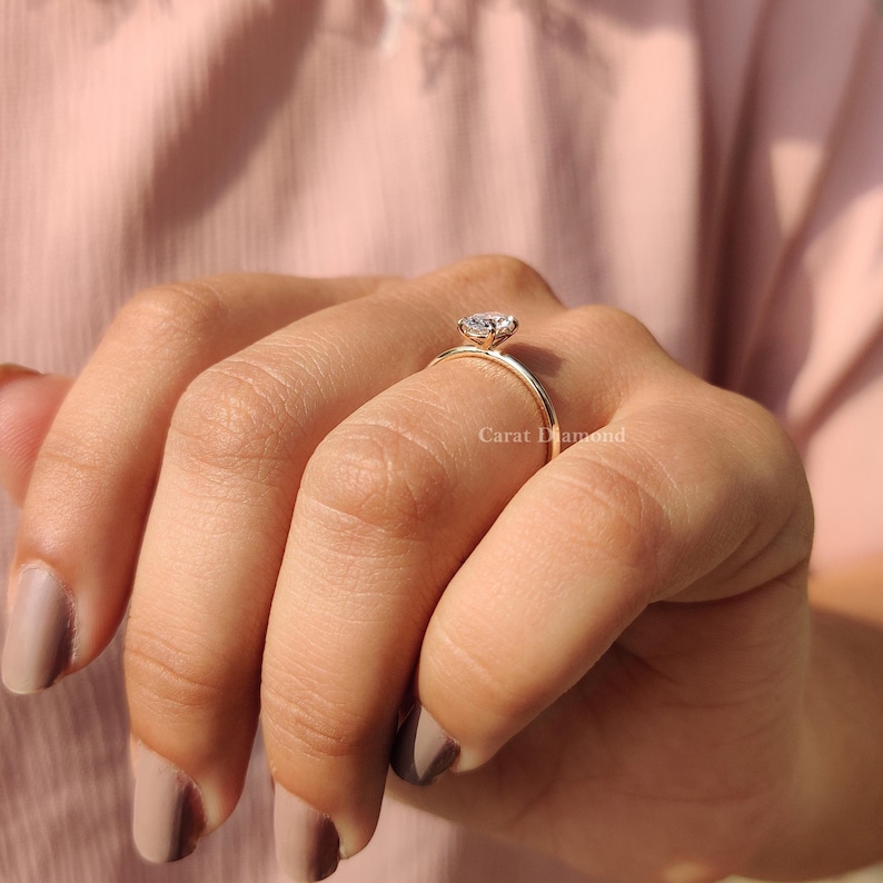 Buy Engagement Ring featuring a handmade oval-cut diamond in a modern design.