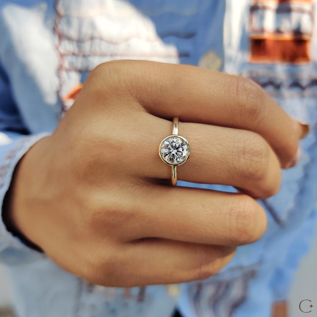 Buy Bezel Set Round Moissanite Engagement Ring: Yellow Gold Solitaire  Online in India