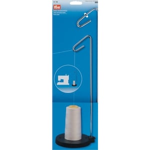 May include: A silver thread stand with a black base supports a large spool of white thread. The stand has a curved top and a hook for guiding the thread. The packaging is blue and features a sewing machine graphic.