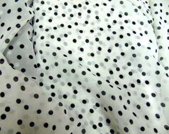 Polka dots printed muslin fabric by the meter, 150cm (59 inches) wide.