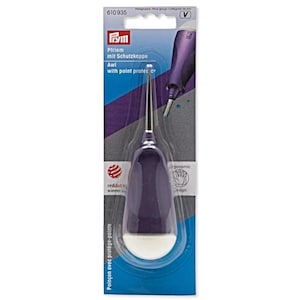 May include: A purple awl with a white base and a silver point, packaged on a card. The packaging includes the text "Pfriem mit Schutzkappe Awl with point protector" and a "reddot winner" logo. The awl is designed with an ergonomic grip.