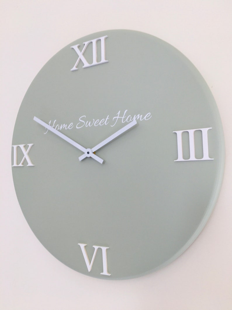 Sage green wall clock with raised roman numerals made with Etsy