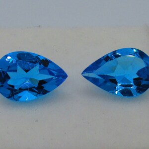 Swiss Blue Topaz, Matched Pair, 6.14 cttw. Pear Cut. Loose Gemstones.