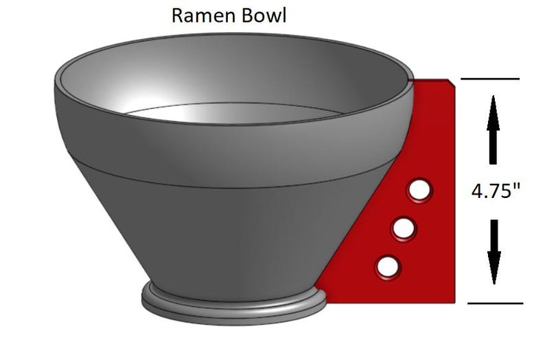 May include: A gray ceramic ramen bowl with a red base and three holes. The bowl is 4.75 inches tall. Ramen Bowl.
