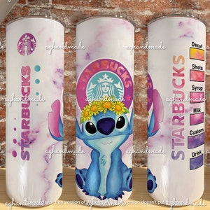May include: A white stainless steel tumbler with a pink and purple marble design. The tumbler features a blue Stitch character wearing a flower crown and the Starbucks logo. The text "STARBUCKS" is written vertically on the tumbler. The right side of the tumbler has a list of drink options, including "Decaf", "Shots", "Syrup", "Milk", "Custom", and "Drink".