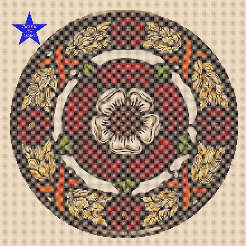 May include: A cross-stitch pattern featuring a white rose with red petals and green leaves, surrounded by a circle of red roses and gold wheat stalks. The design is set against a dark brown background.