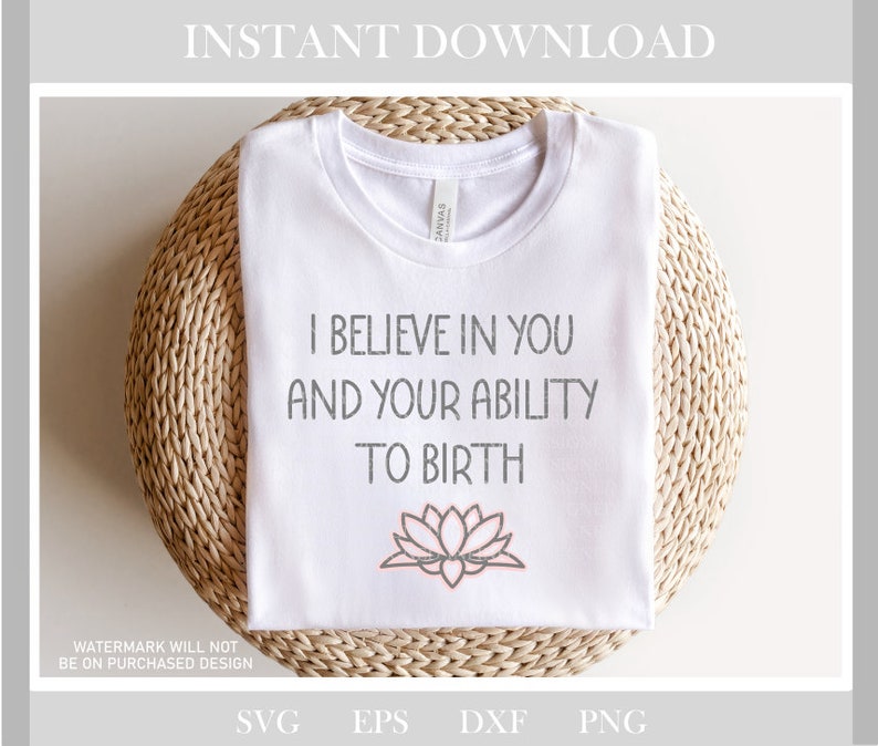 May include: White t-shirt with the text "I believe in you and your ability to birth" in gray and a pink lotus flower graphic.