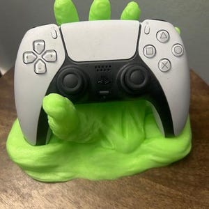 May include: A set of three ceramic mugs with a speckled, matte finish. The mugs are in shades of cream, light gray, and dark gray. Each mug has a simple, minimalist design, perfect for coffee or tea.