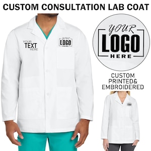 May include: White lab coat with two pockets and a button closure. The coat has the text "YOUR TEXT HERE" and "YOUR LOGO HERE" printed on the front. The text "YOUR LOGO HERE" is in a black square with a black circle around it. The text "CUSTOM PRINTED & EMBROIDERED" is printed below the circle.