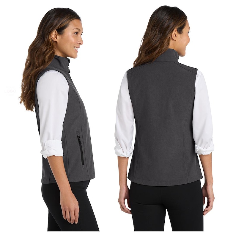 May include: A charcoal grey sleeveless vest featuring a high collar, a full-length front zip, and side pockets with black zip pulls. The garment is shown from both a side profile and a back view, layered over a white long-sleeved shirt.