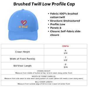 May include: A light blue brushed twill low profile cap with a red heart and the text "11 Print" embroidered on the front. The cap has a self-fabric slide closure and is unstructured. The measurements are: Crown Height: 6 1/4 inches, Width of Front Panel: 7 1/2 inches, Bill/Visor Length: 3/4 inches.