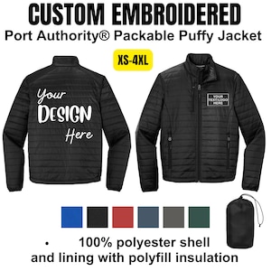 May include: Black packable puffer jacket with a zipper closure and a stand-up collar. The jacket is shown in two views, one with the text "Your Design Here" and the other with the text "Your Text/Logo Here". The jacket is available in sizes XS-4XL. The jacket is made of 100% polyester shell and lining with polyfill insulation.
