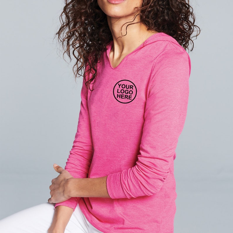 May include: A pink long-sleeved hooded shirt with a v-neck. The shirt has a small circle logo on the left chest that says "YOUR LOGO HERE".