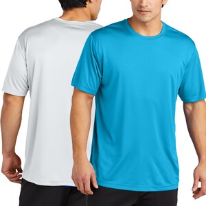 May include: Two short-sleeved t-shirts, one white and one turquoise blue. Both shirts have a crew neck.