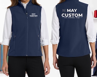 May include: A navy blue softshell vest featuring a stand-up collar and a full-length front zipper. The chest displays the white text MAY CUSTOM. The back features a large white logo with the text MAY CUSTOM Print, Embroidery, Design.
