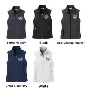 May include: Five sleeveless vests in battleship grey, black, black charcoal heather, dress blue navy, and white. Each vest features a full-length front zip, a stand-up collar, two zipped side pockets, and a circular logo reading YOUR LOGO HERE.
