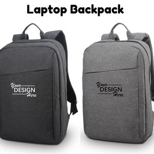Two laptop backpacks standing side by side, with the left one in dark grey and the right one in heather light grey.
