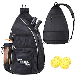 May include: Black  backpack with a  mesh design and multiple pockets. The backpack has a  shoulder strap and a  large pocket on the front that says "Your Design Here".  The backpack is shown with four yellow pickleball balls.