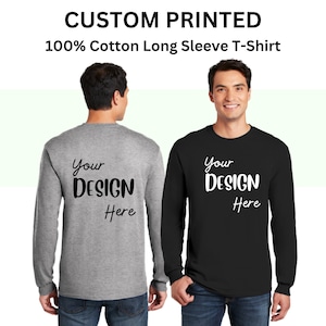 May include: Two long-sleeved t-shirts, one gray and one black, with the text "Your DESIGN Here" printed on the front. The shirts are made of 100% cotton.