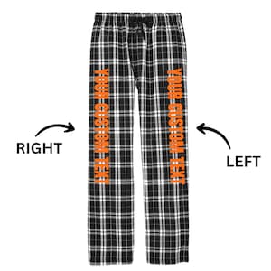 May include: Black and white plaid pajama pants with orange text that says "YOUR CUSTOM TEXT" on each leg.