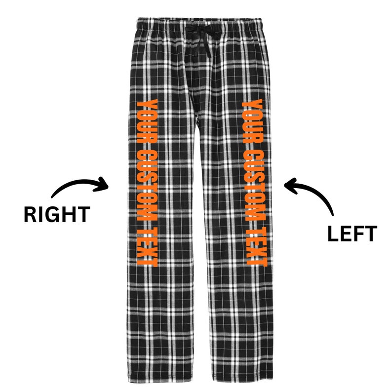 May include: Black and white plaid pajama pants with orange text that says "YOUR CUSTOM TEXT" on each leg.