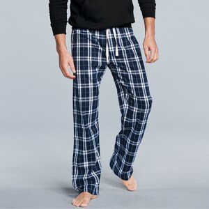 May include: Blue and white plaid pajama pants with a white drawstring.